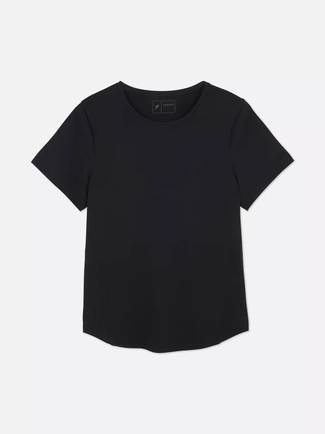 Performance-T-shirt med buet nederkant