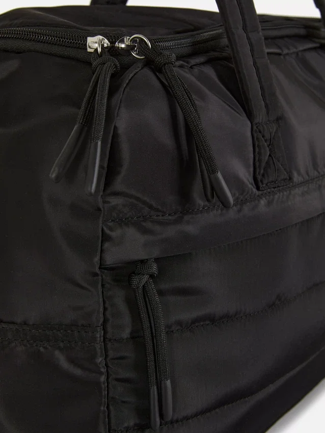 Quiltet håndbagage til under sædet