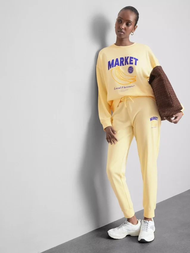 Skinny joggingbukser i bomuldsblanding med print