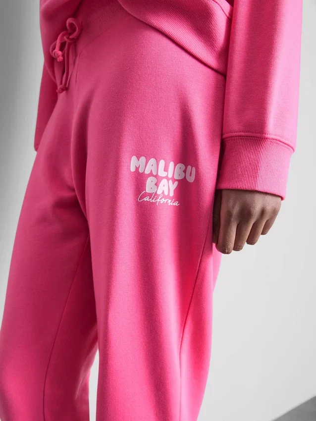 Skinny joggingbukser i bomuldsblanding med print