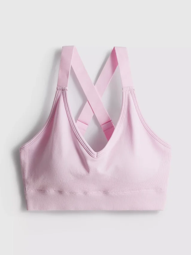 Sømløs aktiv crop-top med krydsede stropper på ryggen