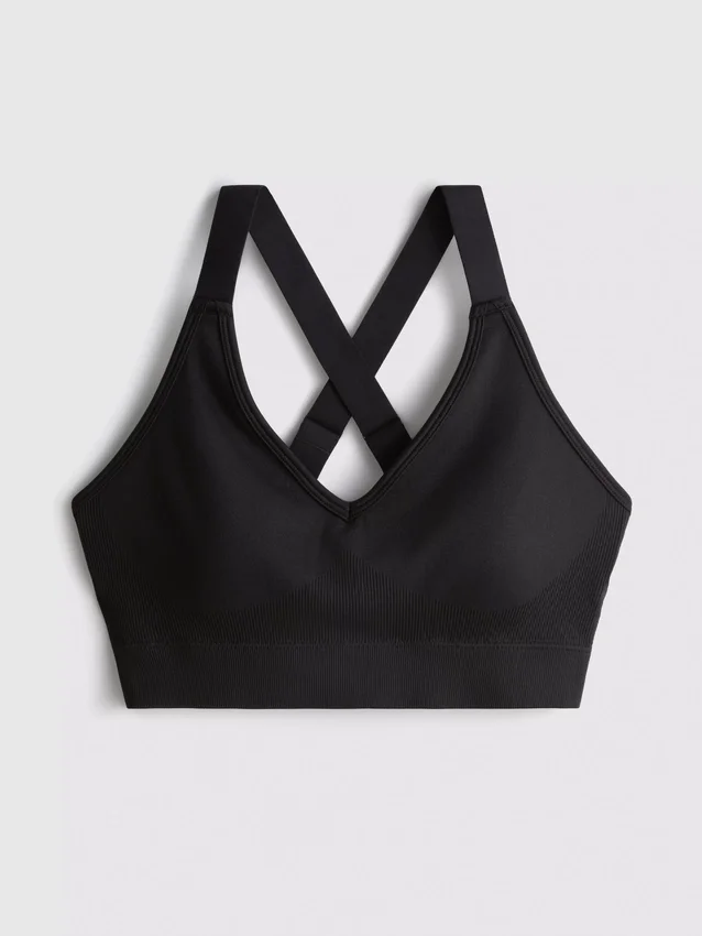 Sømløs aktiv crop-top med krydsede stropper på ryggen