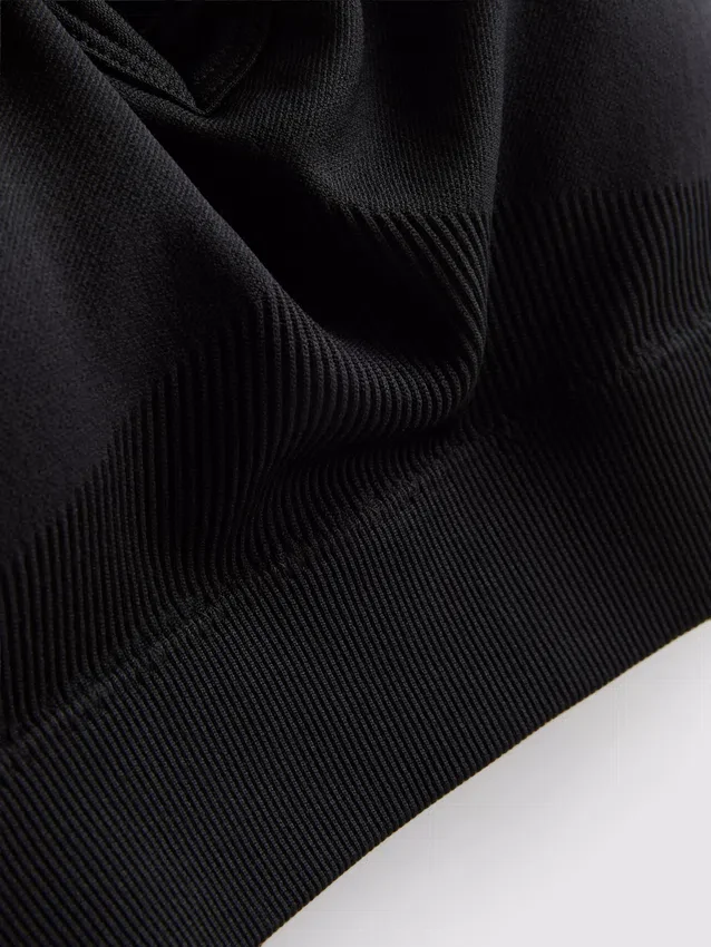 Sømløs aktiv crop-top med krydsede stropper på ryggen