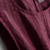 Stribet tanktop med peplum-kant