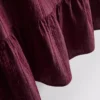 Stribet tanktop med peplum-kant