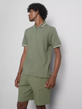 Strikket poloshirt med struktur og lynlås i halsen