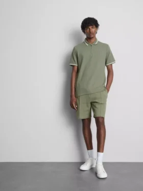 Strikket poloshirt med struktur og lynlås i halsen