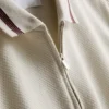 Strikket poloshirt med struktur og lynlås i halsen