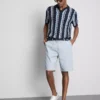 Strikket poloshirt med strukturerede striber
