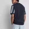 Strikket poloshirt med strukturerede striber