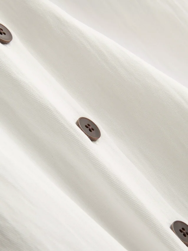 Struktureret halterneck-top med knapper