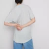 T-shirt med påsyet lomme og lang pasform