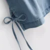 Tanktop i bomuldsdenim med bindebånd i siden