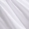 The Edit poplin-top med rynket V-hals