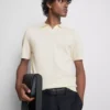The Edit strikket poloshirt