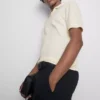 The Edit strikket poloshirt