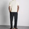 The Edit strikket poloshirt